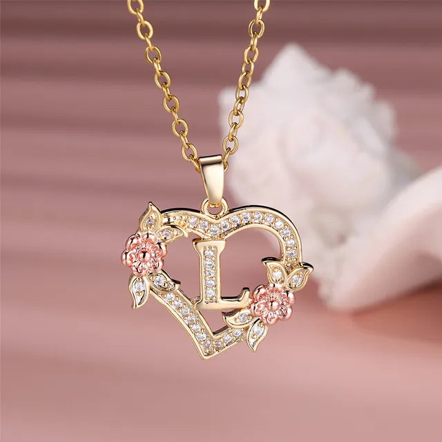 The letter L in a heart pendant necklace with rhinestones