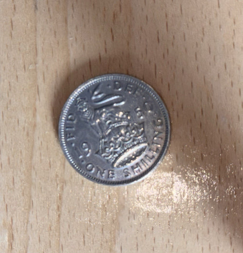 1950 one shilling coin reverse — English lion and shield design