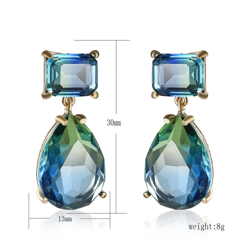 This image details the length of the earrings which is cm in length and 1.3 cm wide. A beautiful statement pair with a square stone at the stud and a pear-shape at the drop