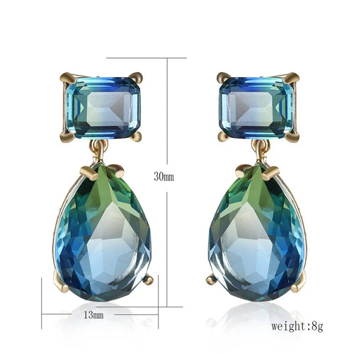 This image details the length of the earrings which is cm in length and 1.3 cm wide. A beautiful statement pair with a square stone at the stud and a pear-shape at the drop