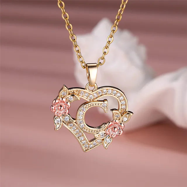 The letter C in a heart pendant necklace with rhinestones