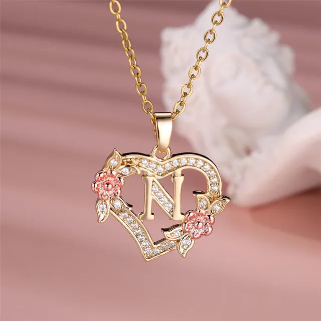The letter N in a heart pendant necklace with rhinestones