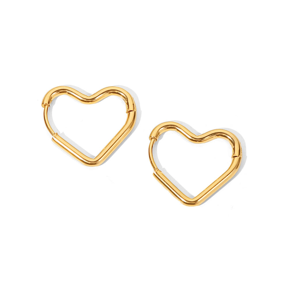 Golden Heart shaped hoop earrings on a white background