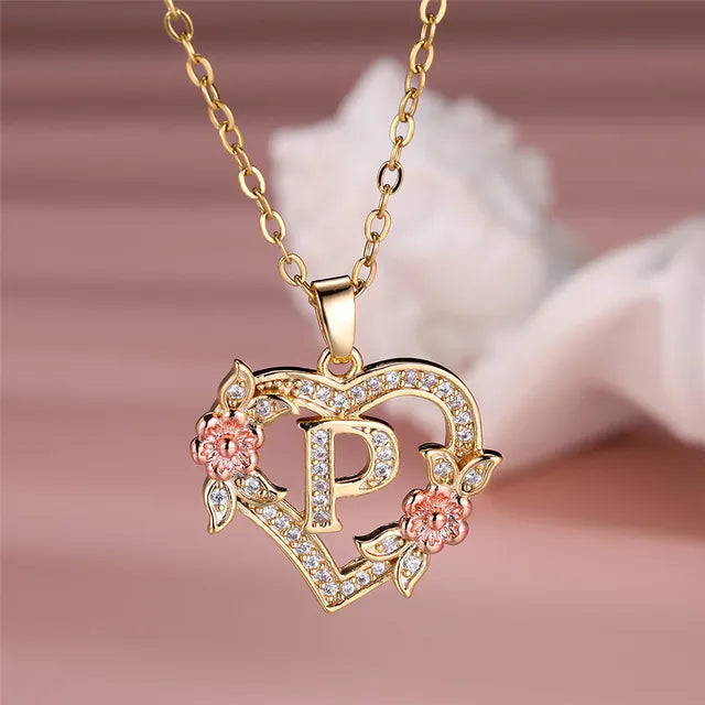 The letter P in a heart pendant necklace with rhinestones
