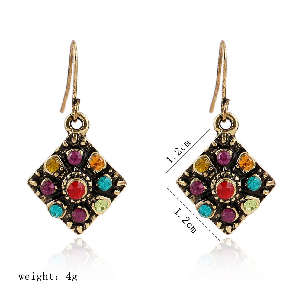 This image displays the weight and dimensions of the earrings. 1.2cm square drop on a fish hook for pierced ears and their weight is 4g