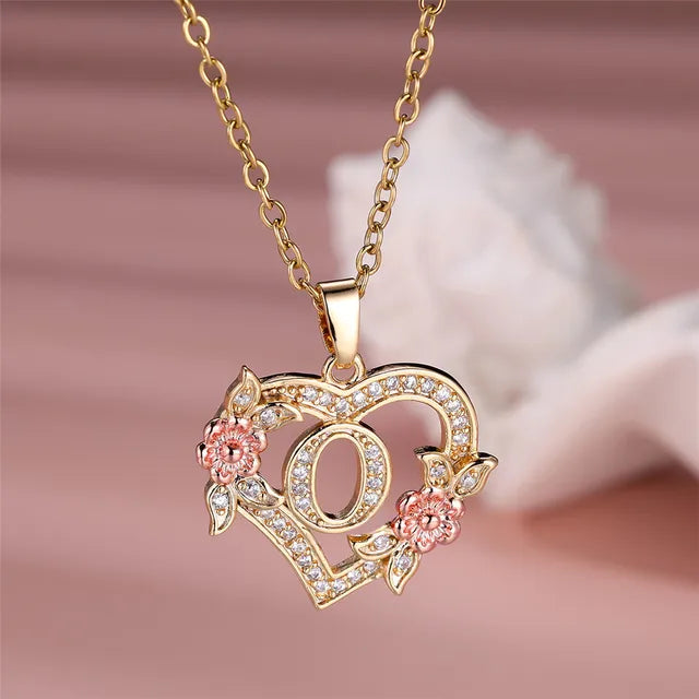 The letter O in a heart pendant necklace with rhinestones