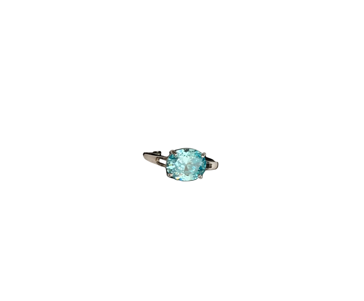 An Aquamarine Coloured stone sterling silver hallmarked ring without a background