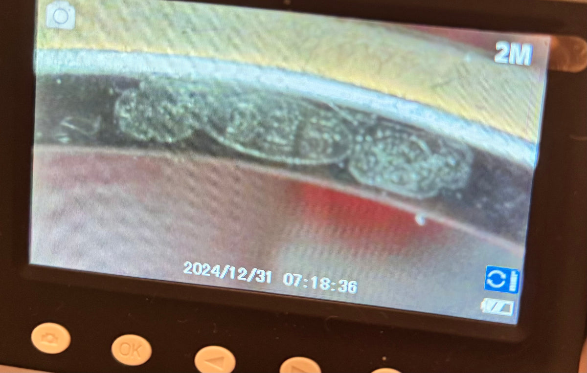 A close-up of a digital display screen showing a detailed inspection of the hallmark of the ring, set against a dark control panel with buttons. Vintage Azende Sterling Silver S925 Ring Pink Stone & Pavé