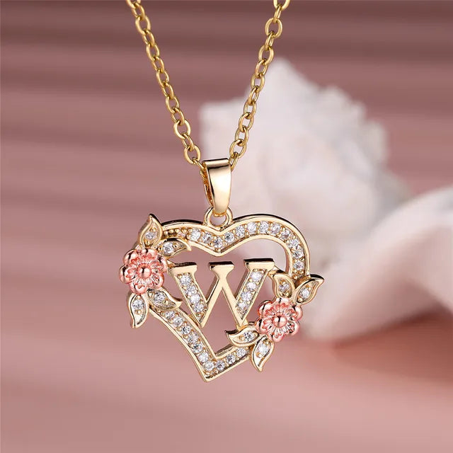 The letter W in a heart pendant necklace with rhinestones