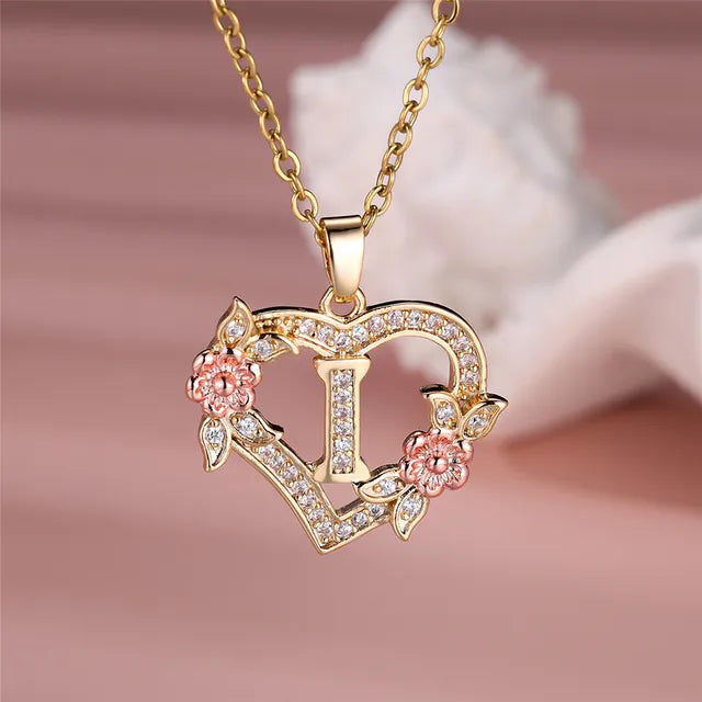 The letter I (Eye) in a heart pendant necklace with rhinestones