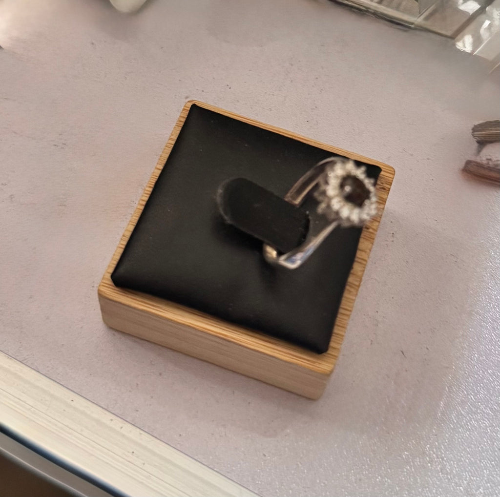 Right side view of the sterling silver halo ring on a jewellery ring display