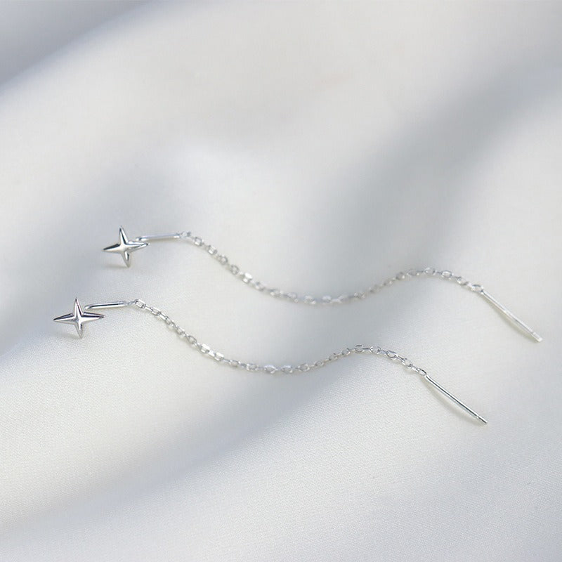 Another view displaying the silver-tone on a white wavy sheet