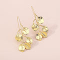 Vintage style Leafy earrings from a different angle shot. Again on a cream background displaying the long hook for pierced ears.