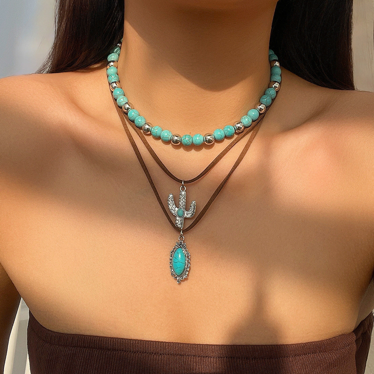 Again 3 layers this time beads and suede cord with Cactus and bezel set stone. Can be worn separately. The choker is beaded this time in a lovely turquoise colour