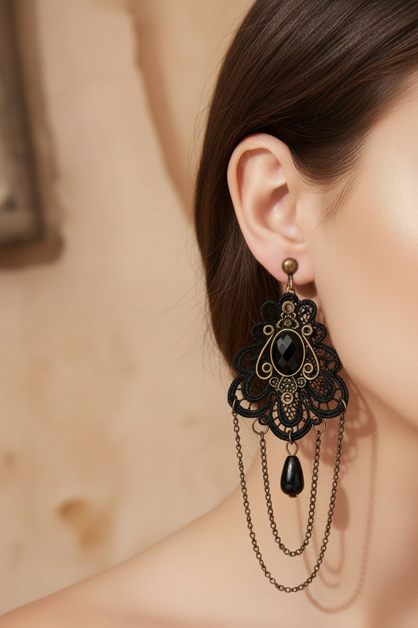 A Vintage rustic style pair of earrings on hooks with a chandelier style.
