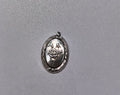 A 2 cm high oval silver pendant featuring an embossed rose design, displayed on a textured gray background.
