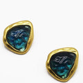 A closer look at the Bezel set Gold tone earring with a Teal interior that is wavy like the sea. On a white background