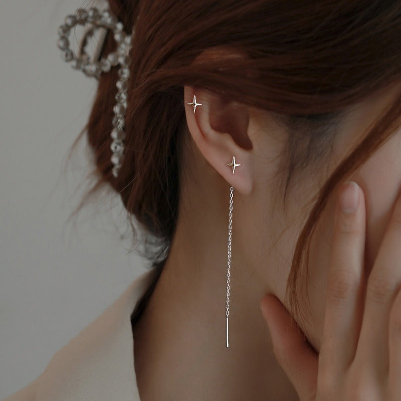 This image displays the silver tone on a person's ear