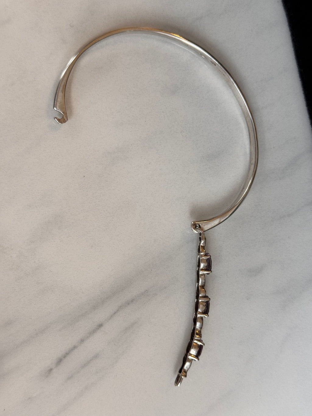 This shows the Bangle wide open on a marble surface 