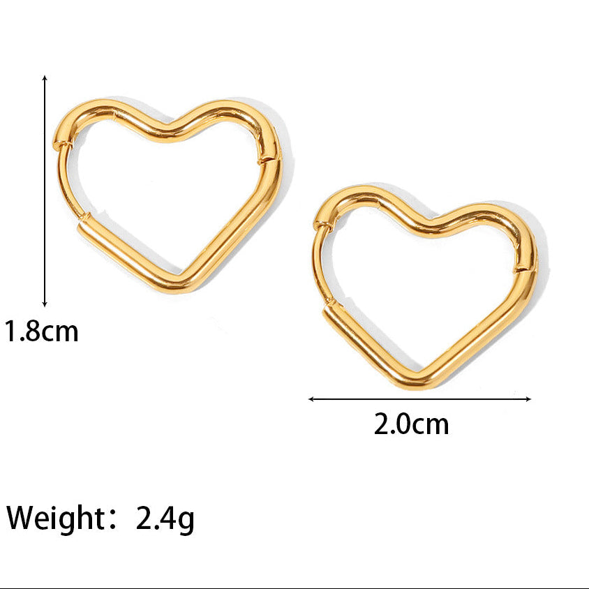 A Vintage style gold tone pair of heart shaped hoops on a white background display with at 2cm and a height of 1.8cm. weight 2.4grams