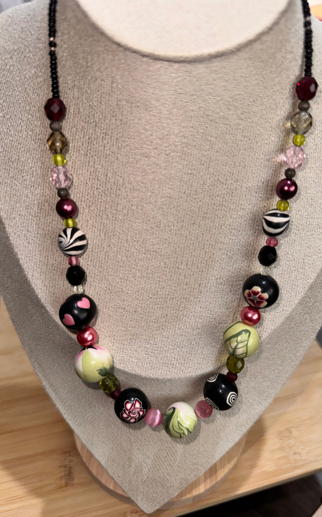  hand painted bead necklace with silver toned clasp in black red pale green and pink color s or Jewellery bust