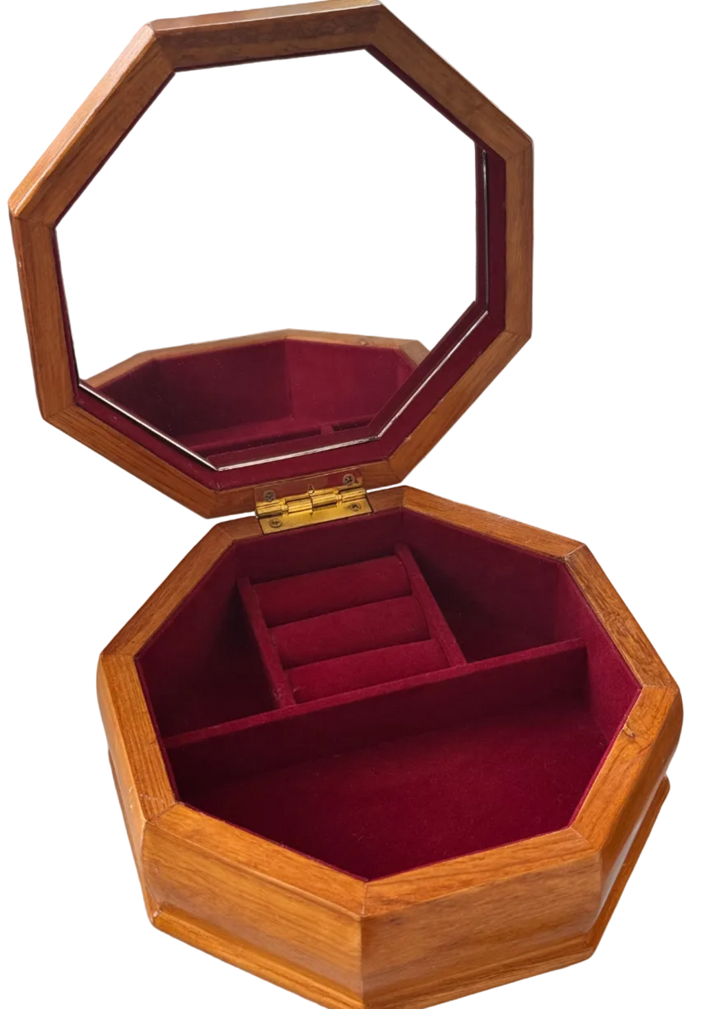 An octagonal wooden jewelry box with an open lid featuring an integrated mirror, lined with deep red velvet interior and divided into small compartments.