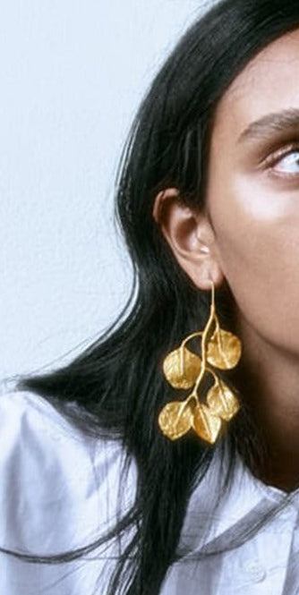 The Stunning Style of vintage Earrigs worn In the ear to give a proportion of size. Very stunning earrings
