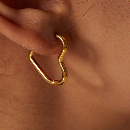 The Gold-toned Heart shaped Hoop In the Ear. Sunning!
