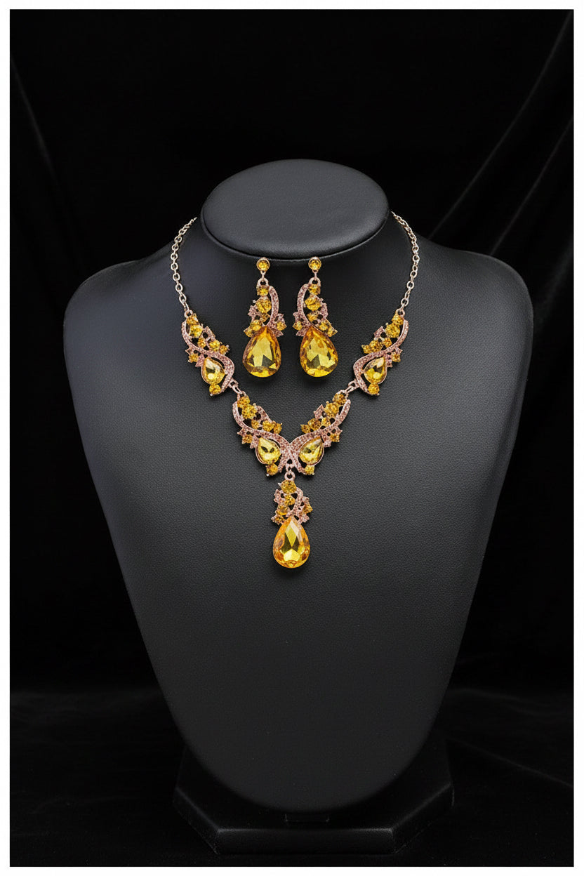 This is the Citrine coloured Jewelry set with necklace and earrings featuring yellow faux gemstones on a black mannequin. Elegant & stylish this will compliment your chosen outfit.