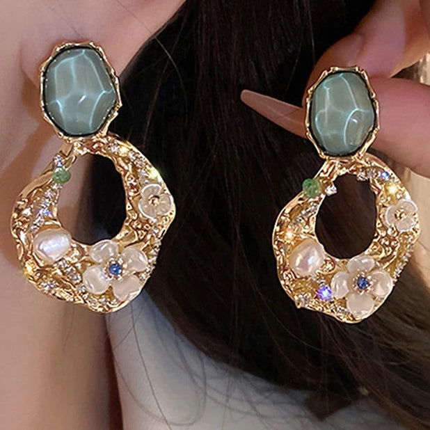 Vintage Abstract Golf-tone and Green Stud & drop Earrings with decorative Faux pearls and Flowers with a central blue rhinestone. Very Pretty Earrings